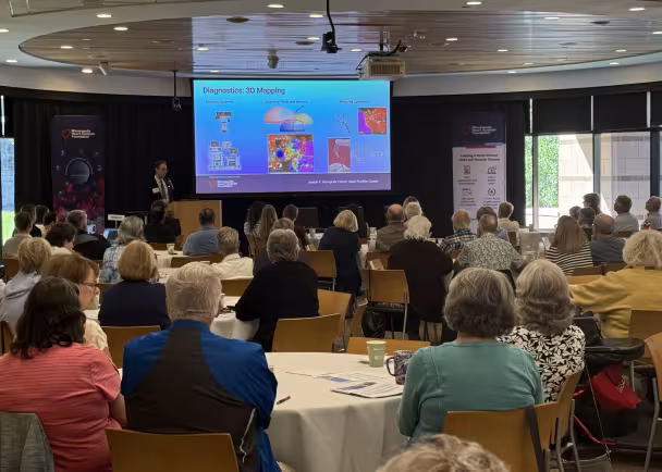 A room full of attendees at a community education event