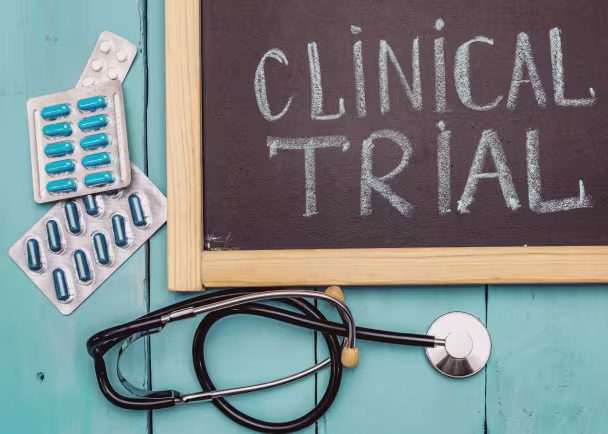 chalkboard with clinical trial written