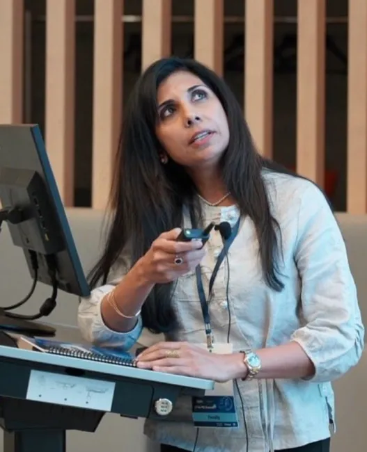 Dr. Kavitha Chinnaiyan delivering a presentation
