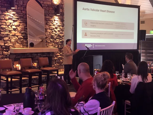 A photo of Dr. Sebastian Iturra speaking at a podium