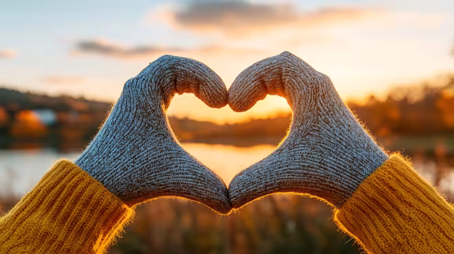 gloved hands making a heart shape